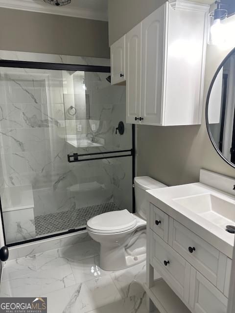 bathroom with vanity, toilet, crown molding, and walk in shower