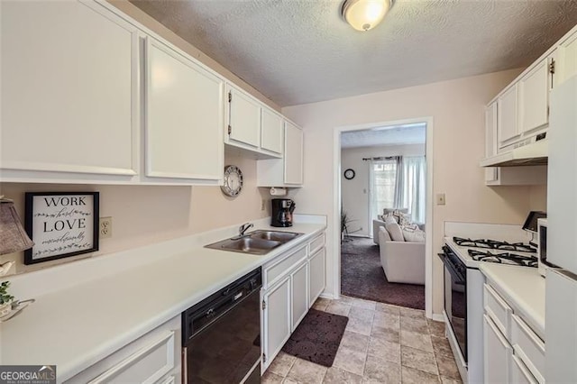 kitchen featuring sink, white cabinetry, black dishwasher, and gas stove