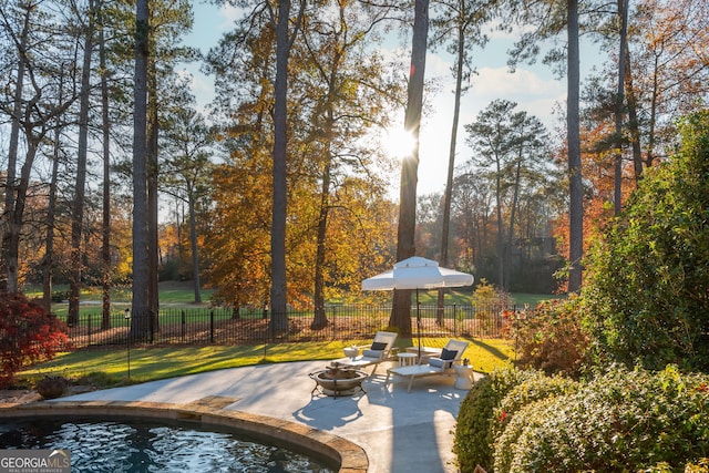 view of patio / terrace featuring a fire pit