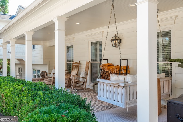 view of exterior entry with covered porch