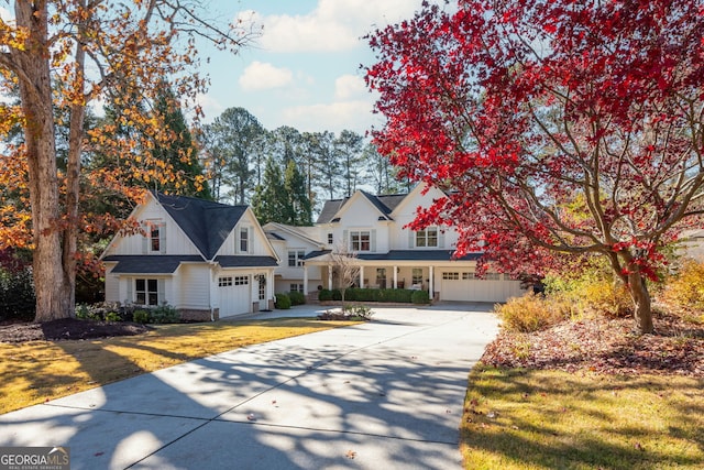 view of front of property featuring a garage and a front yard