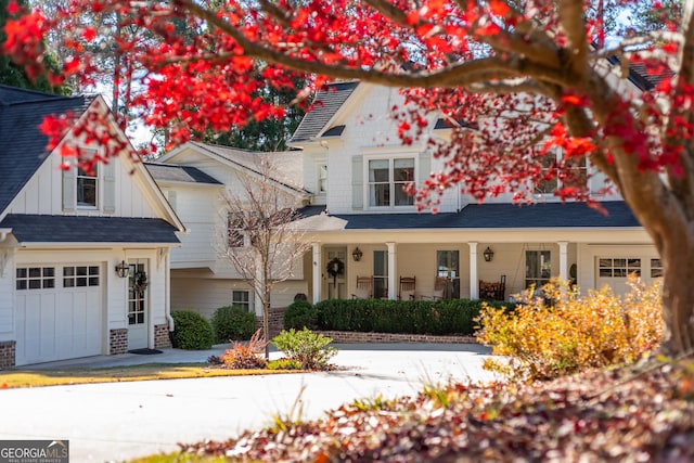 view of front of property with a garage and covered porch