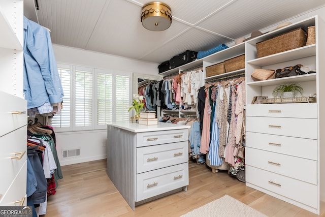 walk in closet featuring light hardwood / wood-style floors