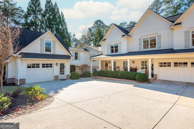 view of front facade with a garage and a porch