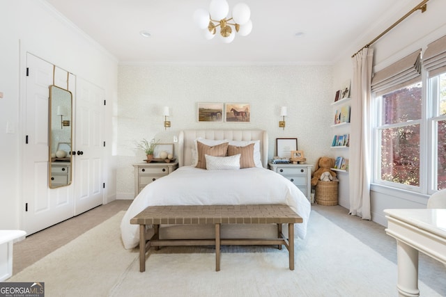 bedroom with an inviting chandelier, light colored carpet, and ornamental molding