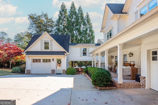 view of front of property with a garage and covered porch