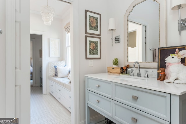 bathroom with vanity and crown molding