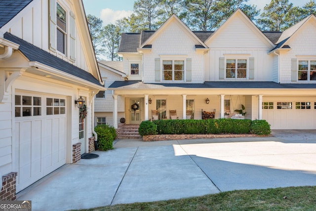 view of front of property featuring a porch and a garage