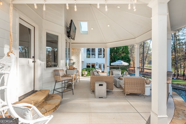 view of patio / terrace featuring an outdoor living space and a gazebo