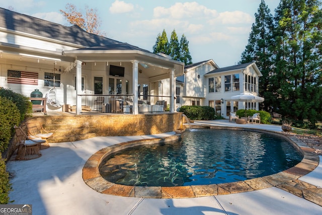 view of swimming pool featuring a patio area