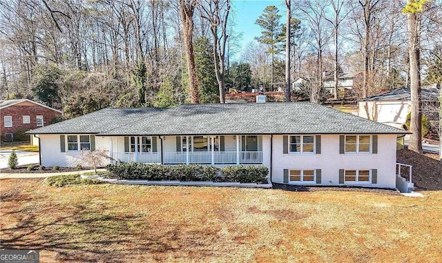 view of front of house with a front lawn and a porch