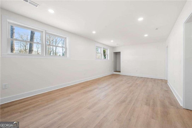 unfurnished room with light hardwood / wood-style flooring