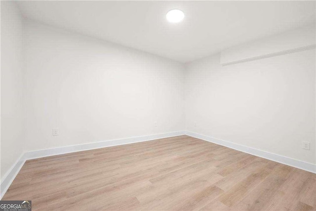 unfurnished room featuring light wood-type flooring