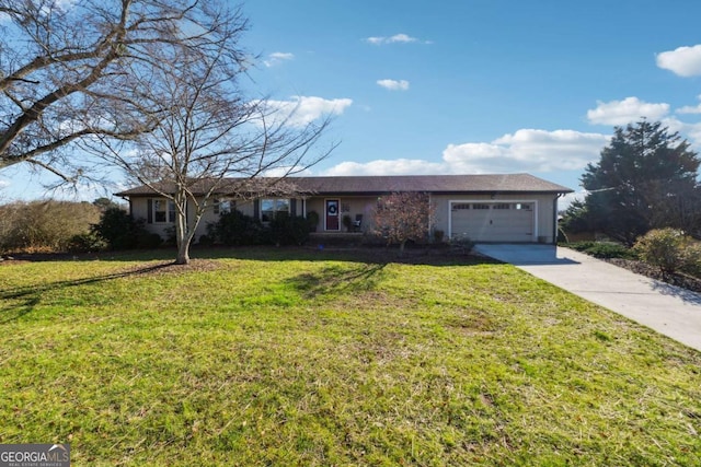 ranch-style house featuring a front yard and a garage