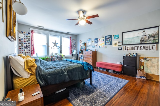 bedroom featuring ceiling fan and dark wood-type flooring