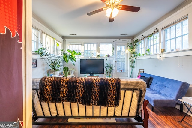 living room featuring hardwood / wood-style flooring and ceiling fan