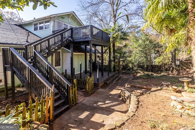 view of side of property with a wooden deck