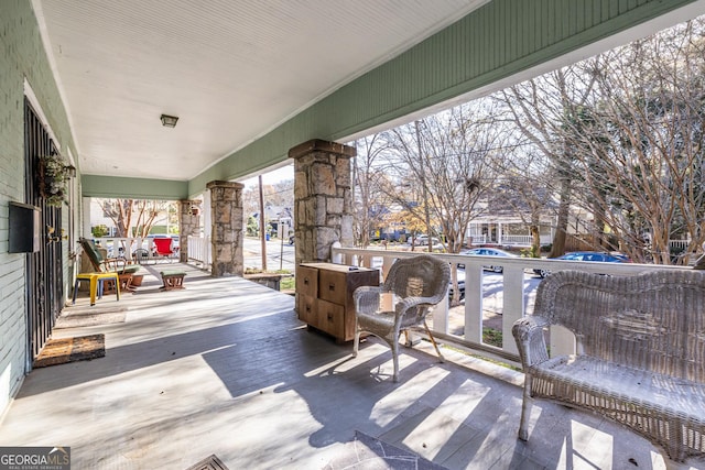 wooden terrace with a porch