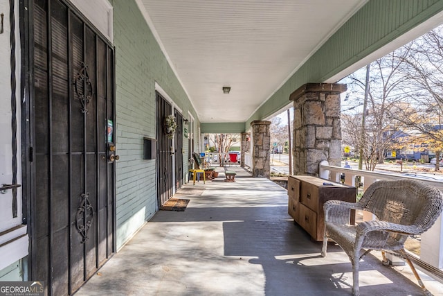 view of patio featuring a porch