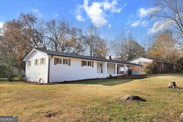 ranch-style house with a front lawn