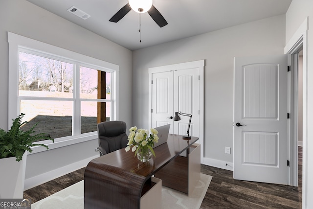 office space featuring ceiling fan and dark hardwood / wood-style flooring