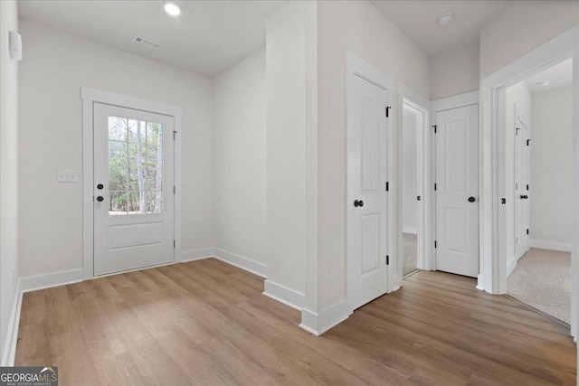 entryway with light hardwood / wood-style flooring