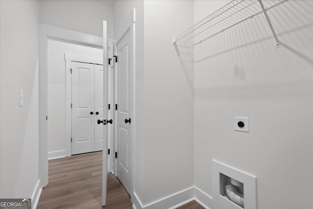 laundry room featuring wood-type flooring and hookup for an electric dryer