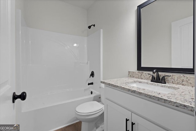 full bathroom featuring vanity,  shower combination, and toilet