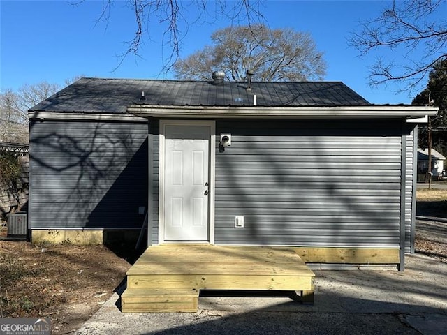 back of house featuring central AC