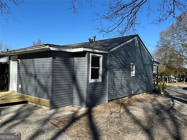 view of side of property featuring a patio area