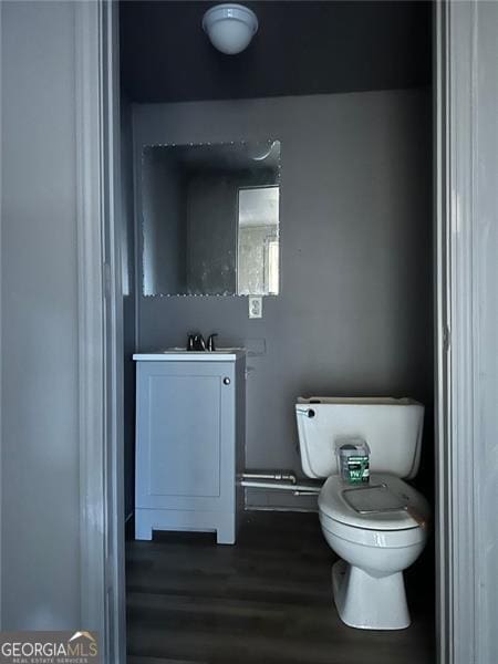 bathroom with toilet and vanity