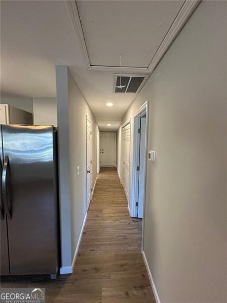 corridor with wood-type flooring