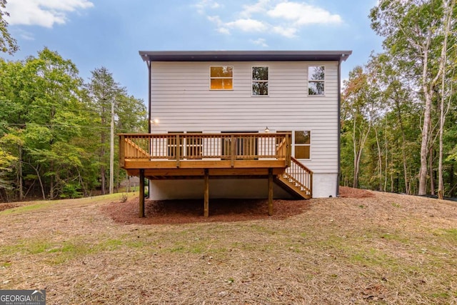 back of property featuring a deck