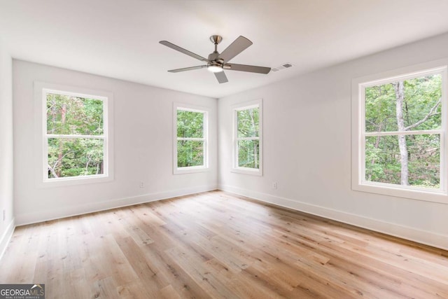 unfurnished room featuring light hardwood / wood-style floors and ceiling fan