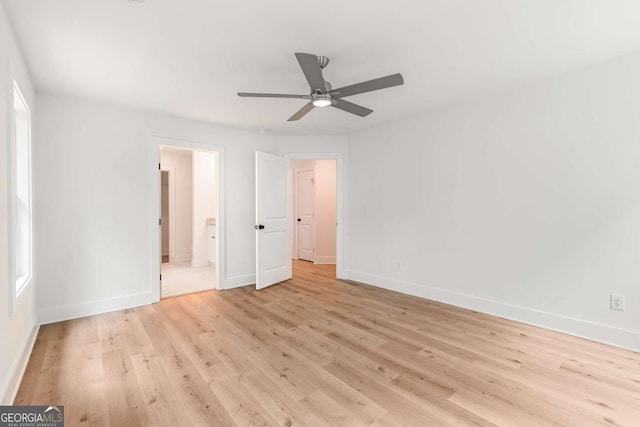 unfurnished bedroom featuring ceiling fan, connected bathroom, and light wood-type flooring