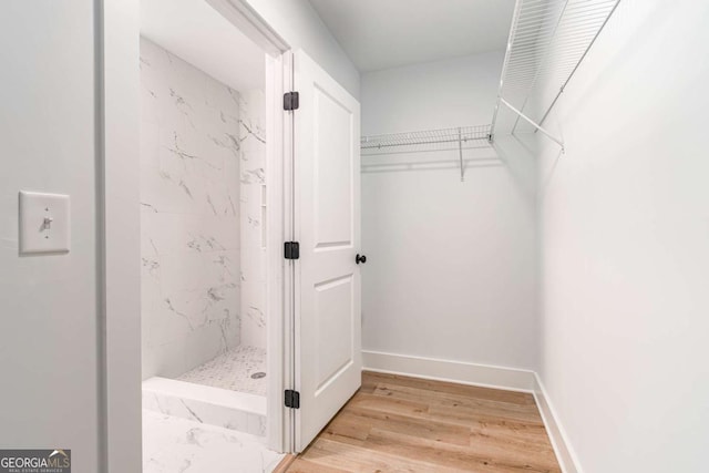 spacious closet with light wood-type flooring