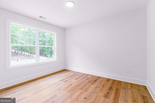 unfurnished room featuring light hardwood / wood-style floors