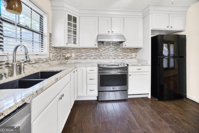 kitchen featuring sink, white cabinets, dark hardwood / wood-style flooring, stainless steel appliances, and light stone counters