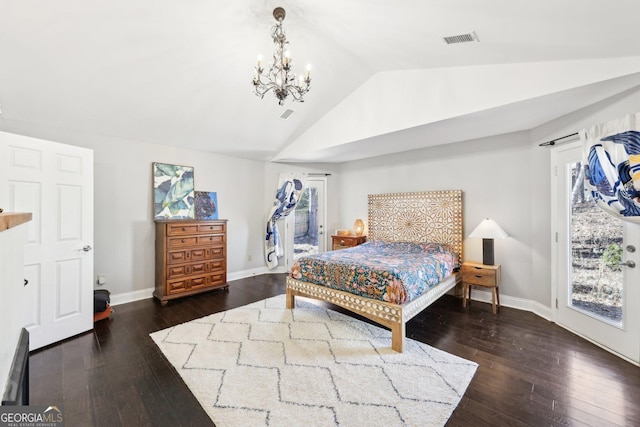 bedroom with vaulted ceiling, an inviting chandelier, dark hardwood / wood-style floors, and multiple windows