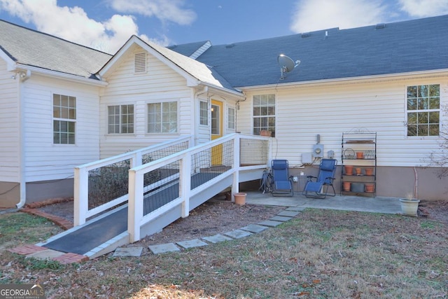 back of property featuring a patio