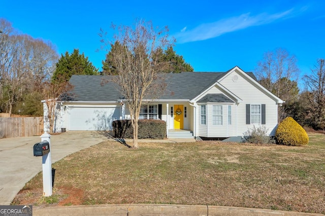 ranch-style house featuring a garage and a front yard