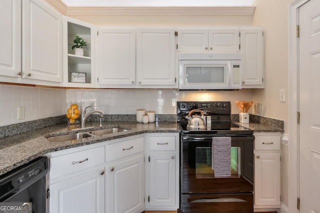 kitchen with black appliances and white cabinets