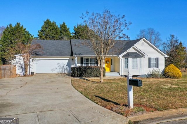 ranch-style home featuring a garage and a front lawn