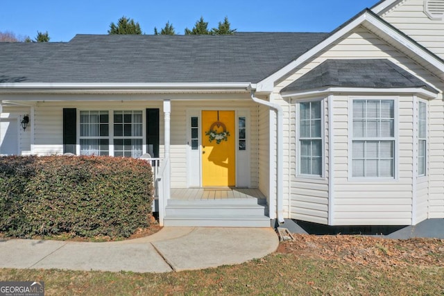 doorway to property featuring a porch