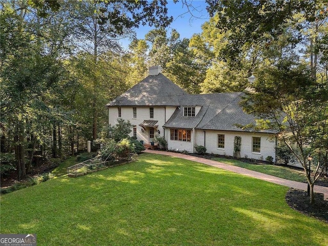 view of front of home with a front yard