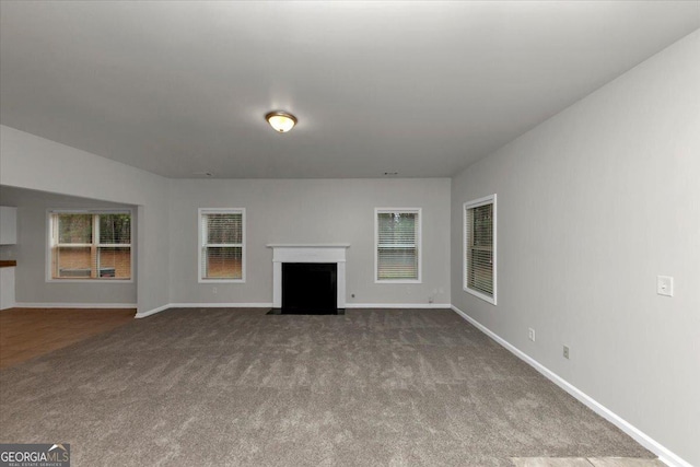 unfurnished living room with carpet flooring