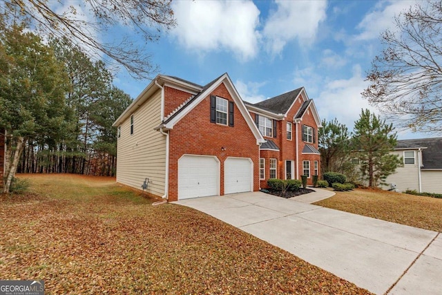 front of property featuring a garage and a front lawn