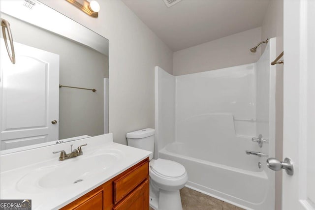 full bathroom featuring shower / bathtub combination, toilet, vanity, and tile patterned flooring