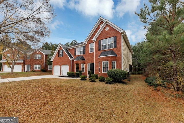 front of property featuring a garage and a front lawn