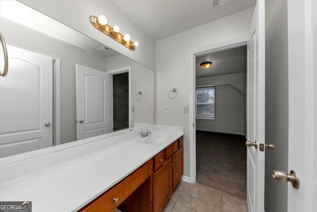 bathroom with tile patterned floors and vanity